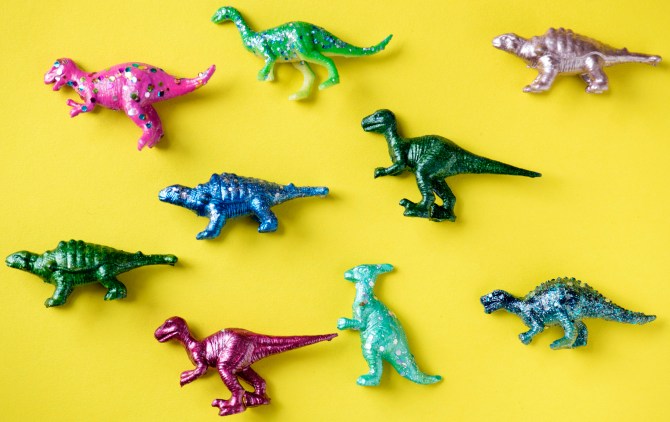 Various animal toy figures in a colorful background