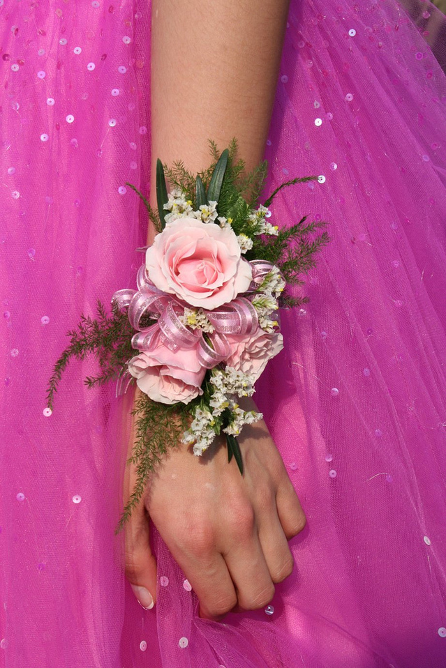 close-up-pink-dress-flower-arm-hand-1576956-639x958